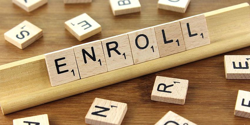 scrabble pieces spell enroll