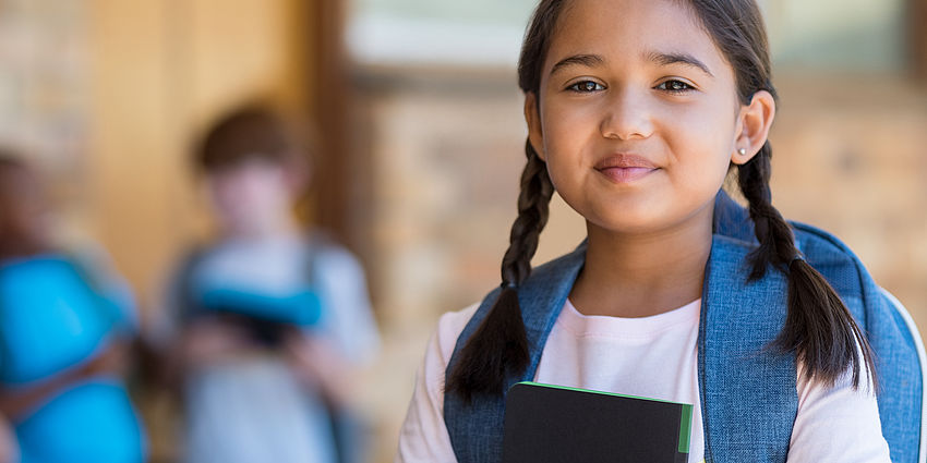 school girl smiling at camera