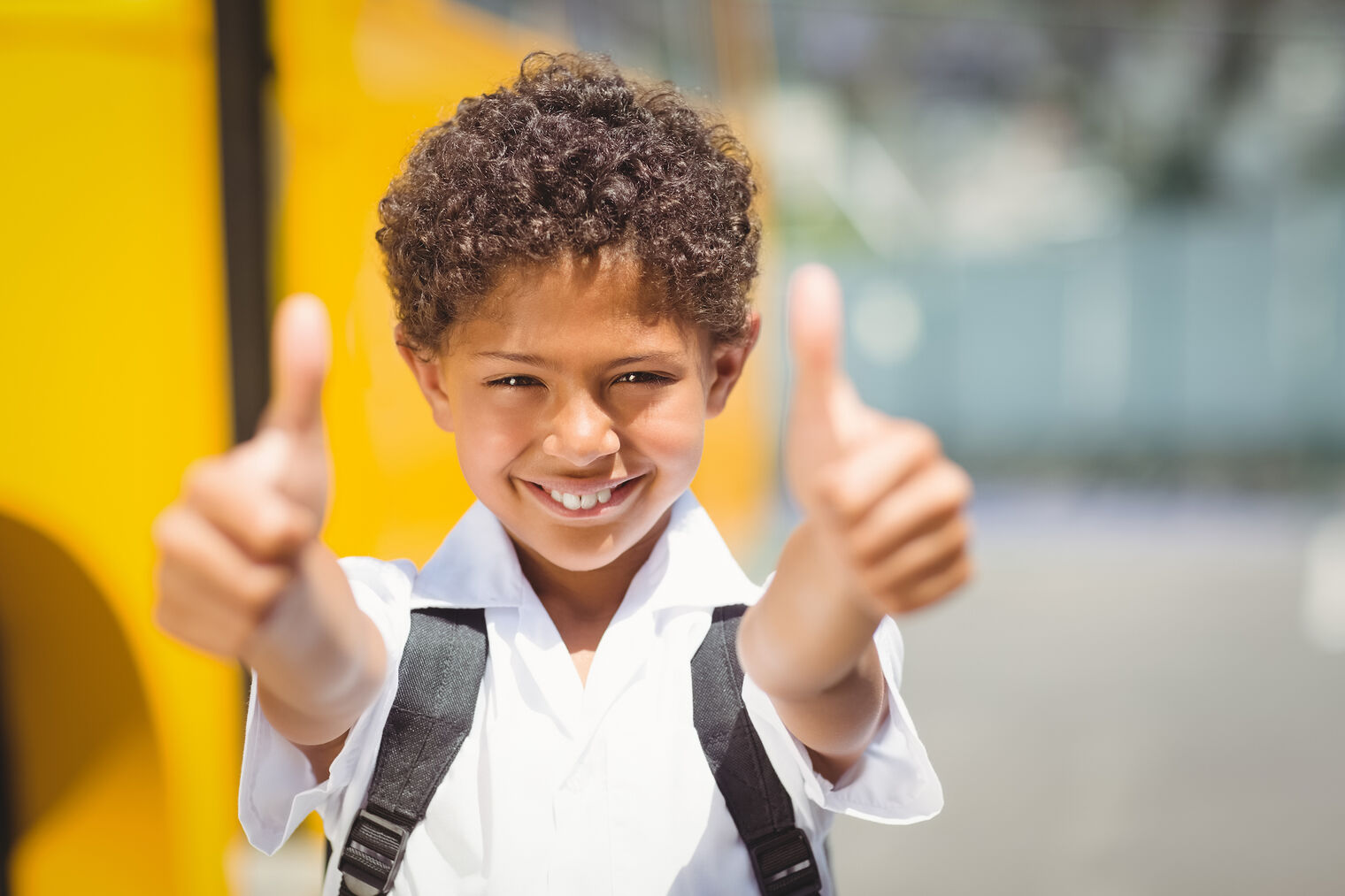 student with thumbs up