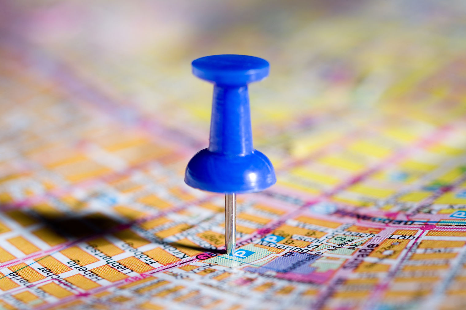 blue pushpin on a map